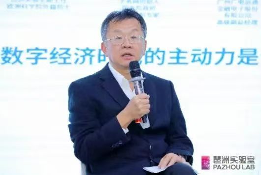 a person in a suit holding a microphone